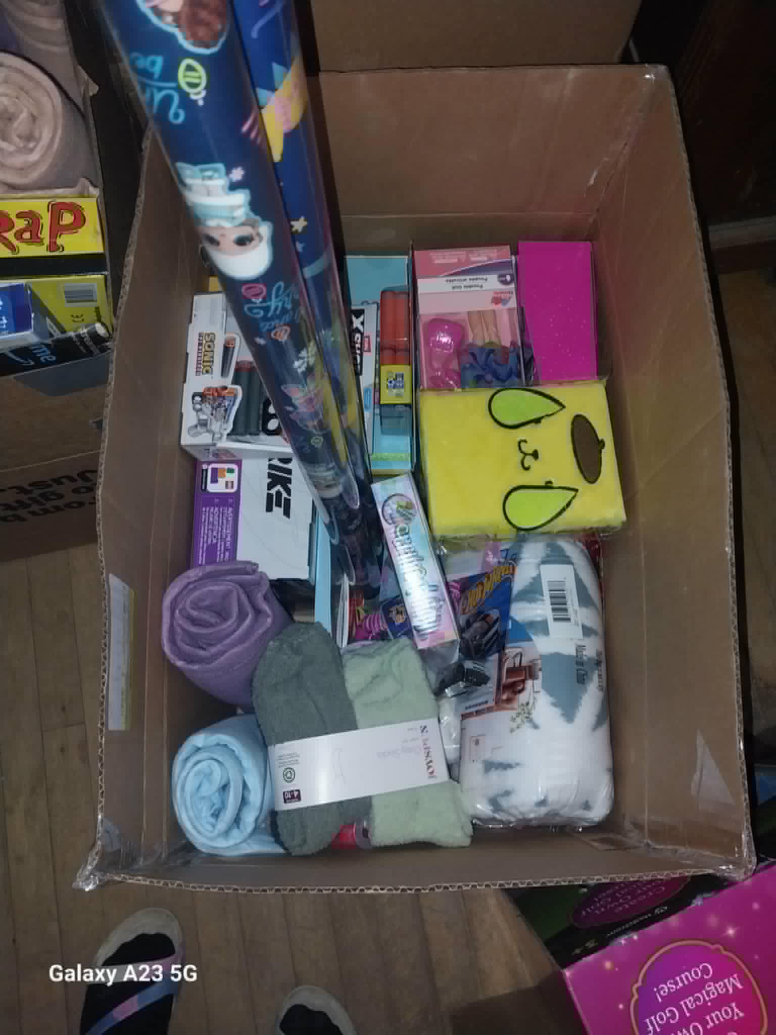 A box of wrapped gifts, toys, and blankets for the Community Porch Christmas program in Hoosick Falls NY