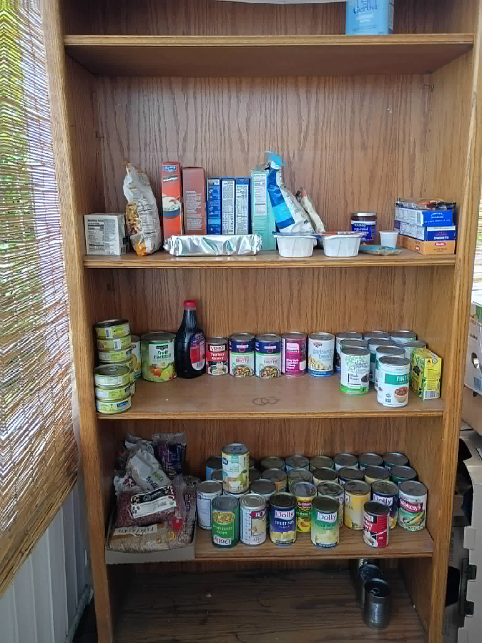Shelves of canned goods and pantry staples on the Community Porch in Hoosick Falls NY