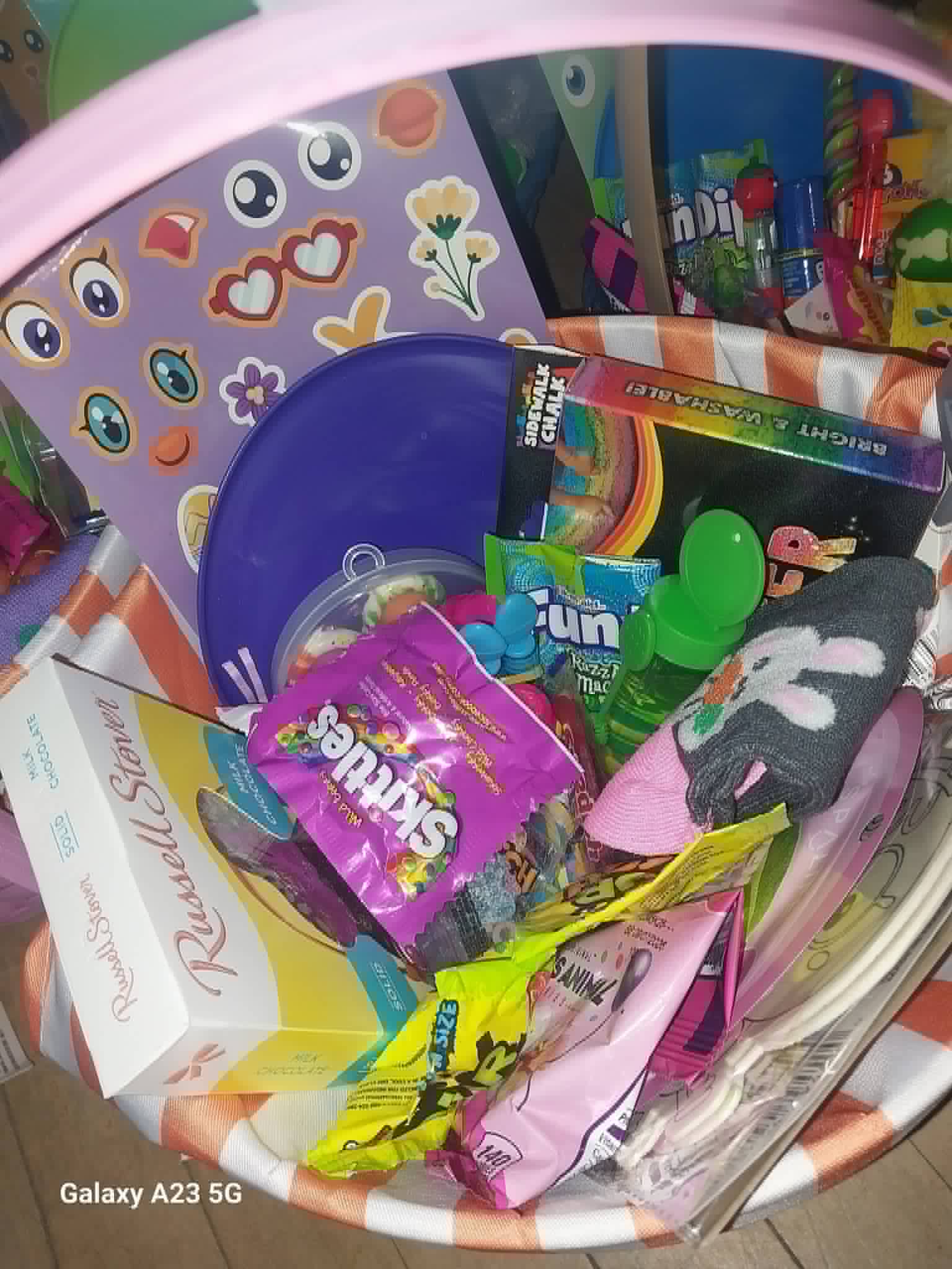 An Easter basket filled with candy, sidewalk chalk, and toys from the Community Porch in Hoosick Falls NY