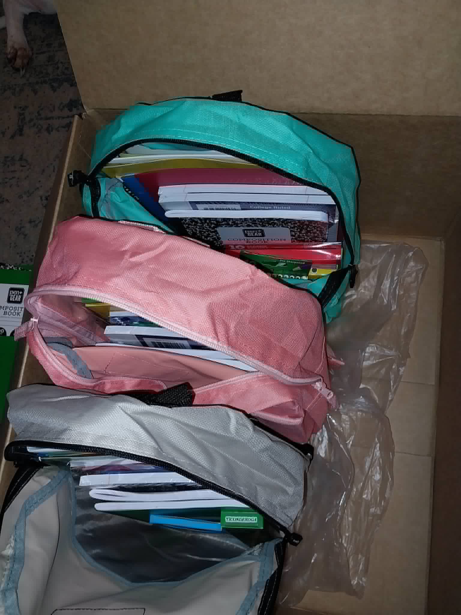 Backpacks packed with notebooks and school supplies for the Community Porch backpack program in Hoosick Falls NY