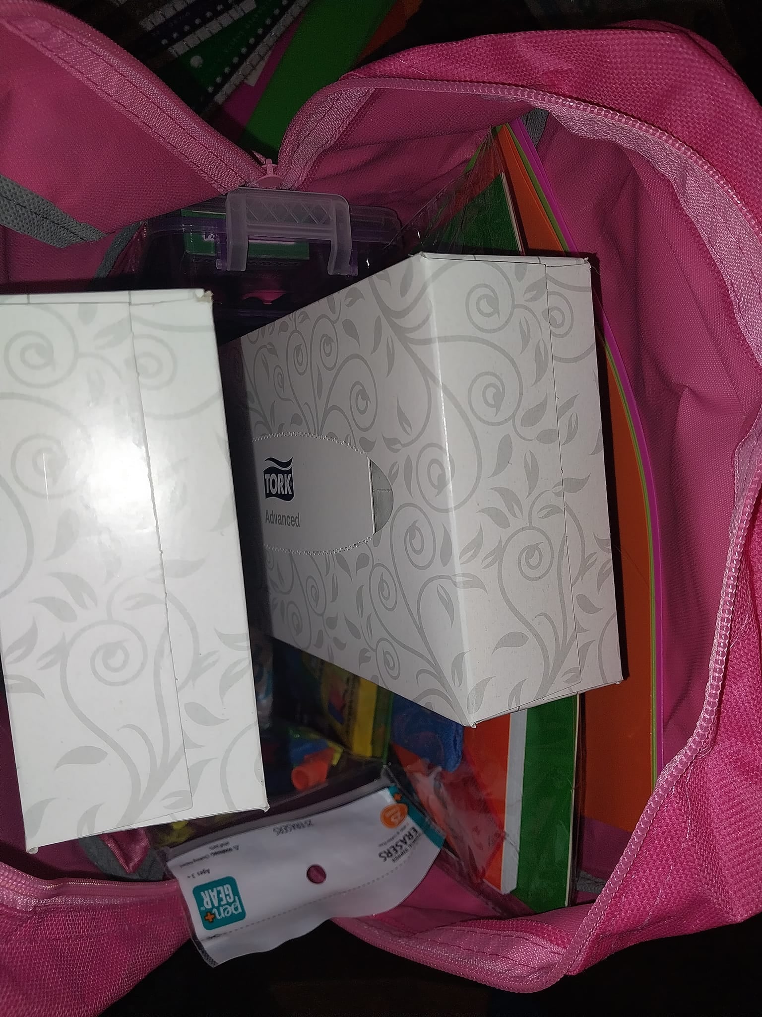 A backpack filled with tissues, folders, and school supplies for the Community Porch backpack program in Hoosick Falls NY