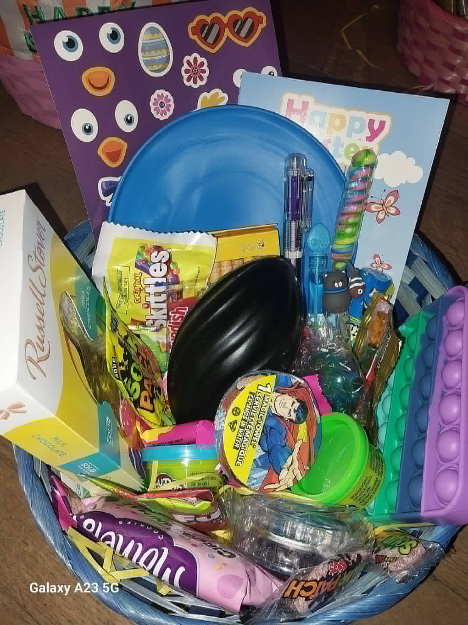 An Easter basket with candy, toys, and a Happy Easter card from the Community Porch in Hoosick Falls NY