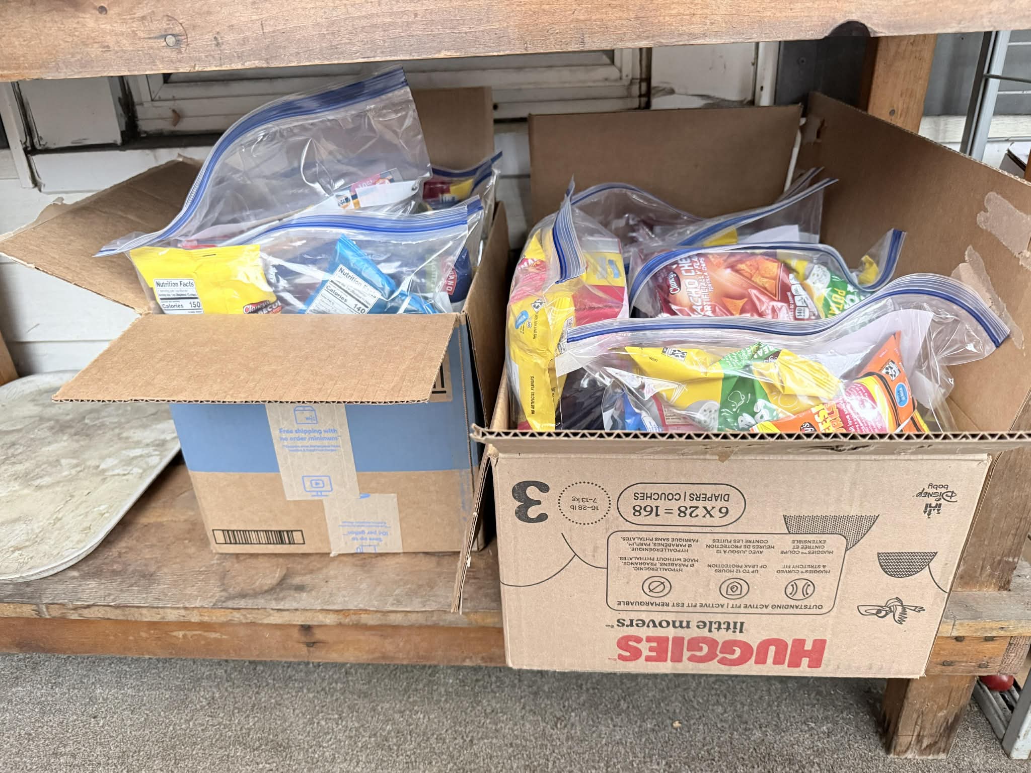 Boxes of grab and go snack bags on the Community Porch in Hoosick Falls NY
