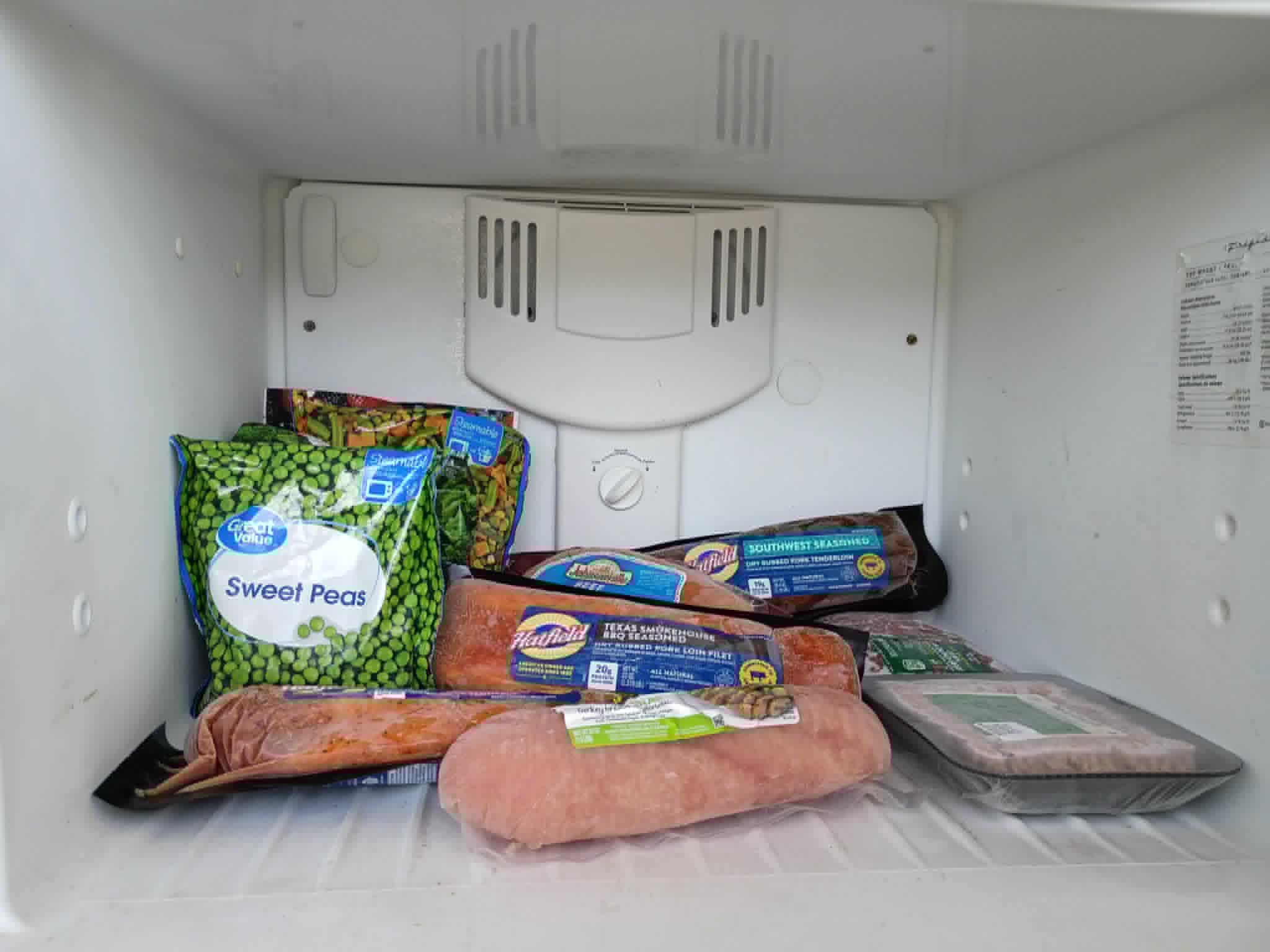 A freezer on the Community Porch in Hoosick Falls NY stocked with frozen meat and vegetables
