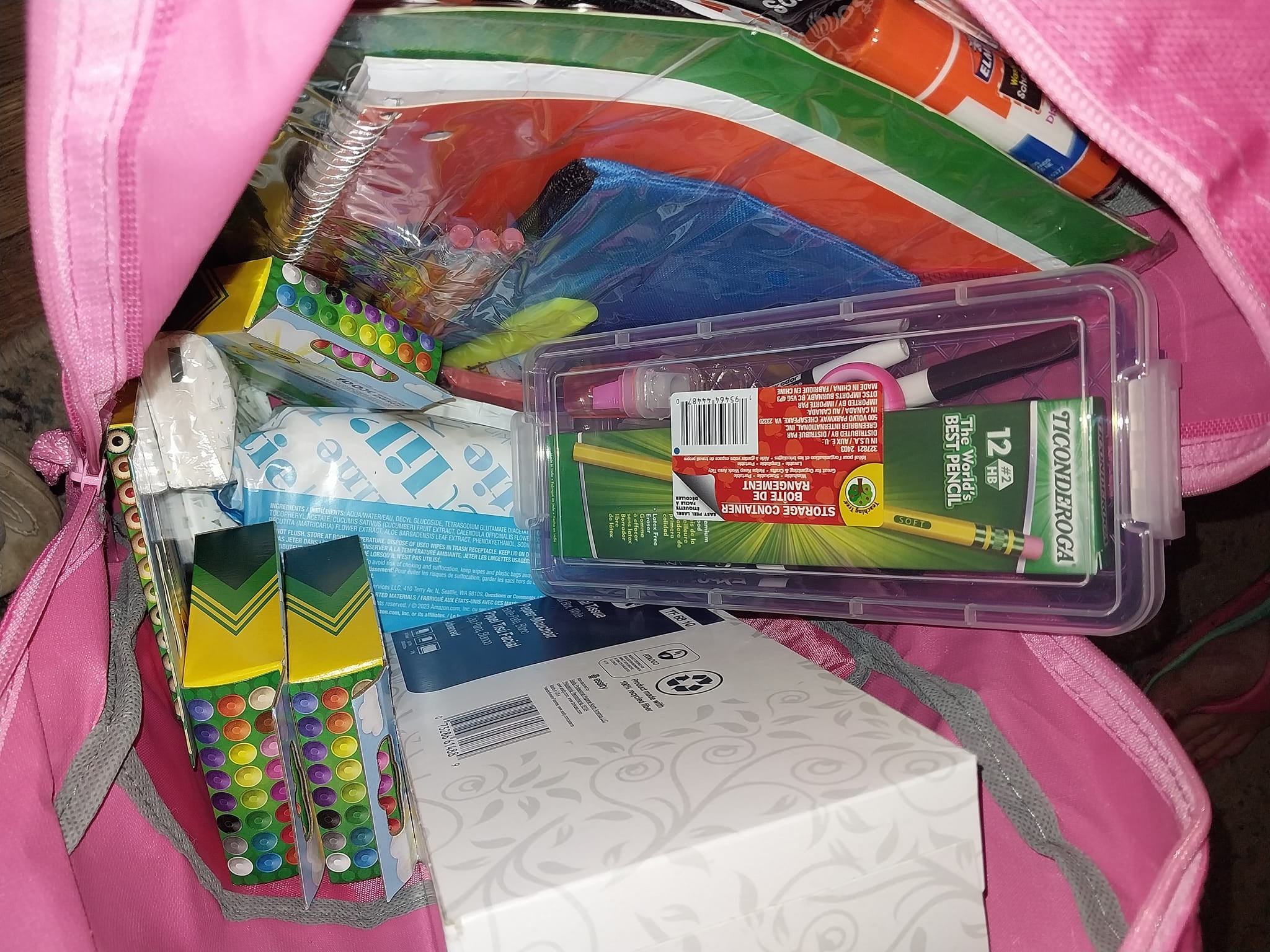 A backpack filled with pencils, crayons, and school supplies for the Community Porch backpack program in Hoosick Falls NY