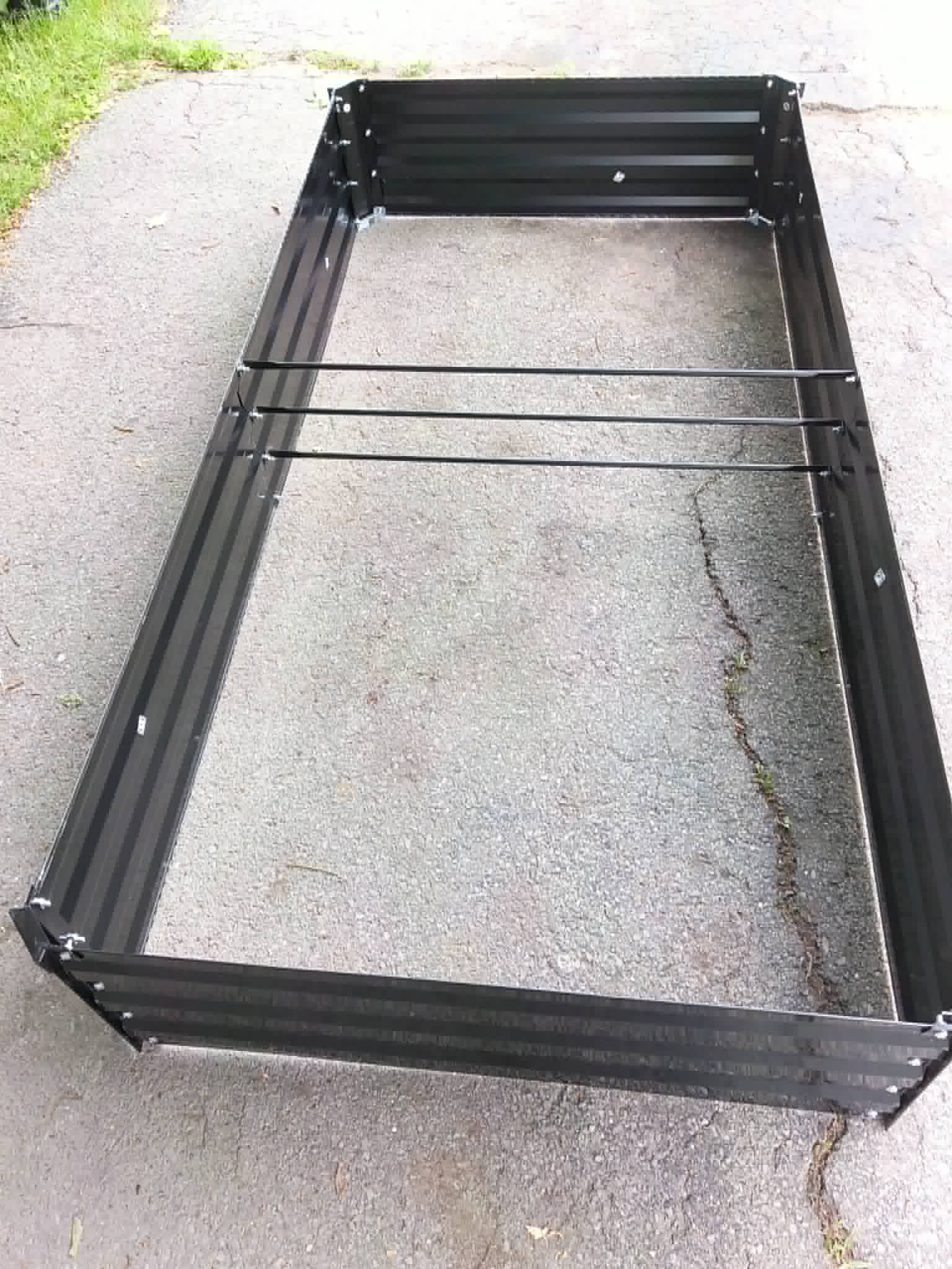 A galvanized metal raised garden bed being assembled for the Community Porch Grow and Share program in Hoosick Falls NY